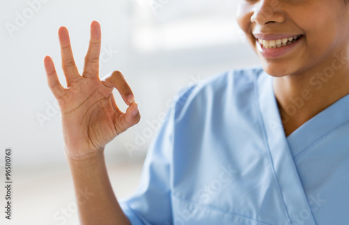 close up of african medic or nurse showing ok sign