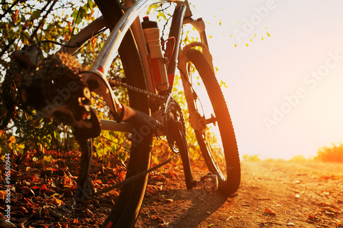 Detail of cyclist man feet riding mountain bike on outdoor