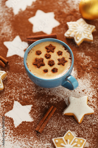 Beautiful composition with cup of cappuccino and Christmas cookies