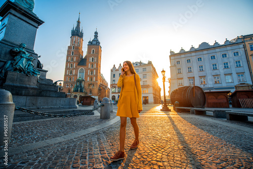 Woman walking in the old city center of Krakow 