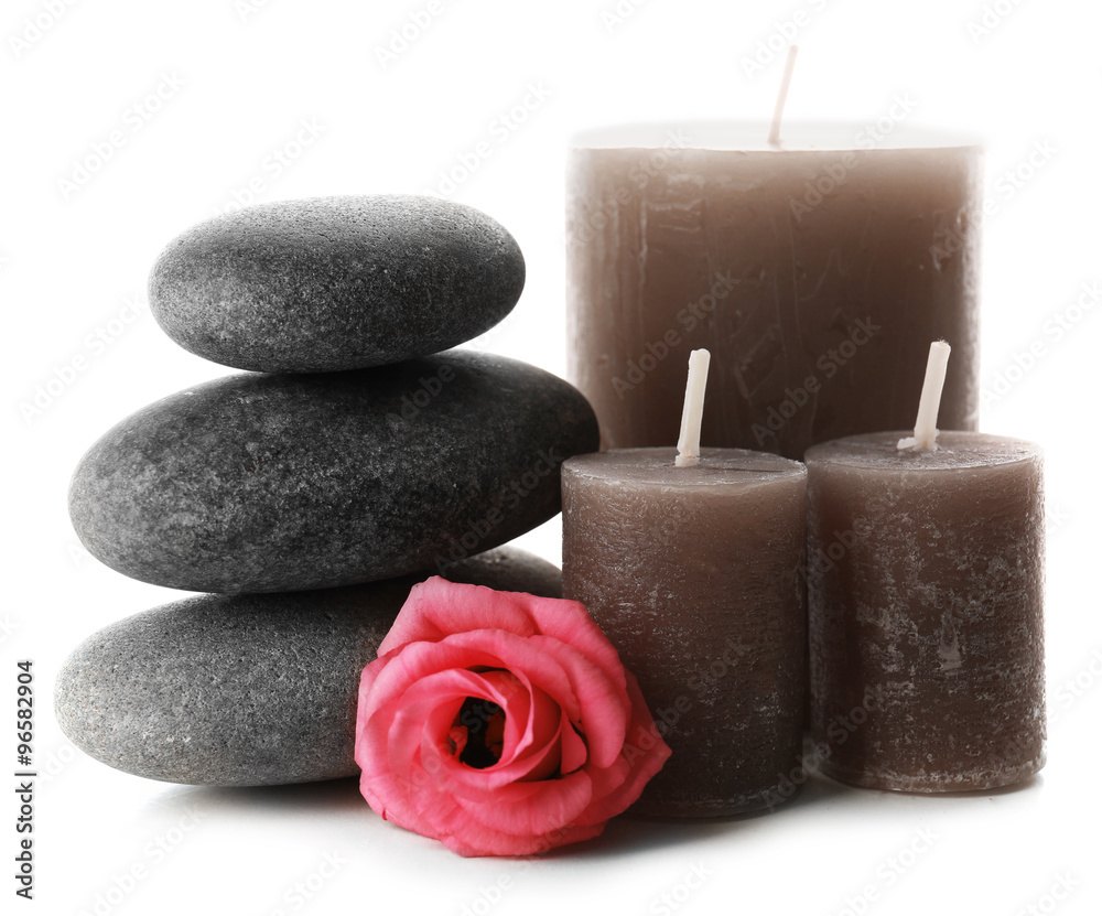 Aroma candles with pebbles and flower isolated on white background Aroma candles with pebbles and flower isolated on white background