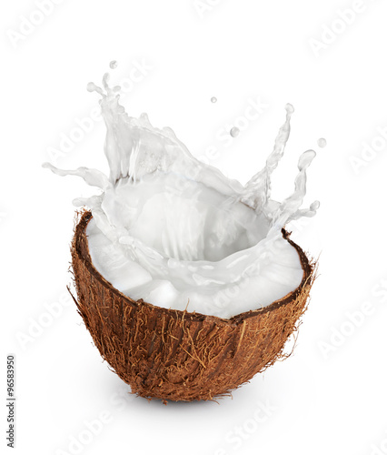 Coconut with milk splash on white background.