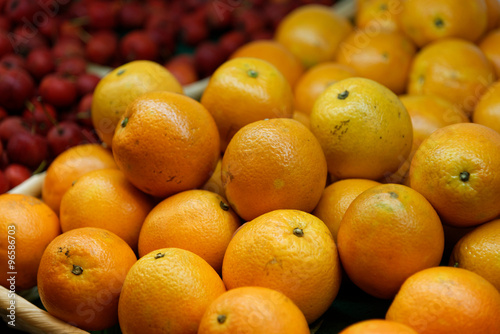 Many oranges on a market shelf