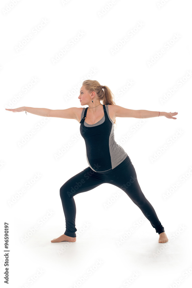 Pregnant woman doing sport exercises in yoga style Pregnant woman doing sport exercises in yoga style