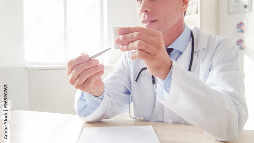 Doctor explaining how to take specific medication. Doctor explaining how to take specific medication.