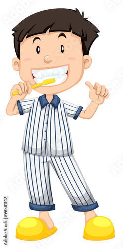 Boy in striped pajamas brushing teeth