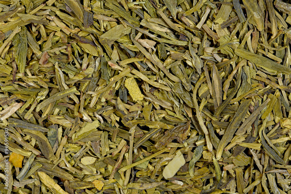 Long leaves green loose tea (Dragon well), macro photo, texture.