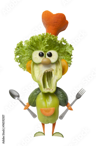 Funny vegetable cook with fork and spoon