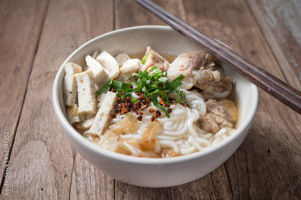 Spicy vietnamese Noodle Soup with wooden chopsticks Spicy vietnamese Noodle Soup with wooden chopsticks