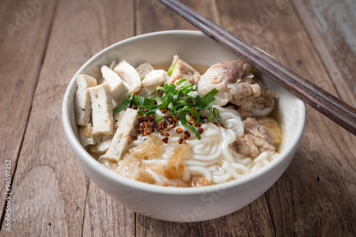 Spicy vietnamese Noodle Soup with wooden chopsticks