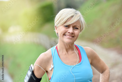 Portrait of smiling senior woman after exercising