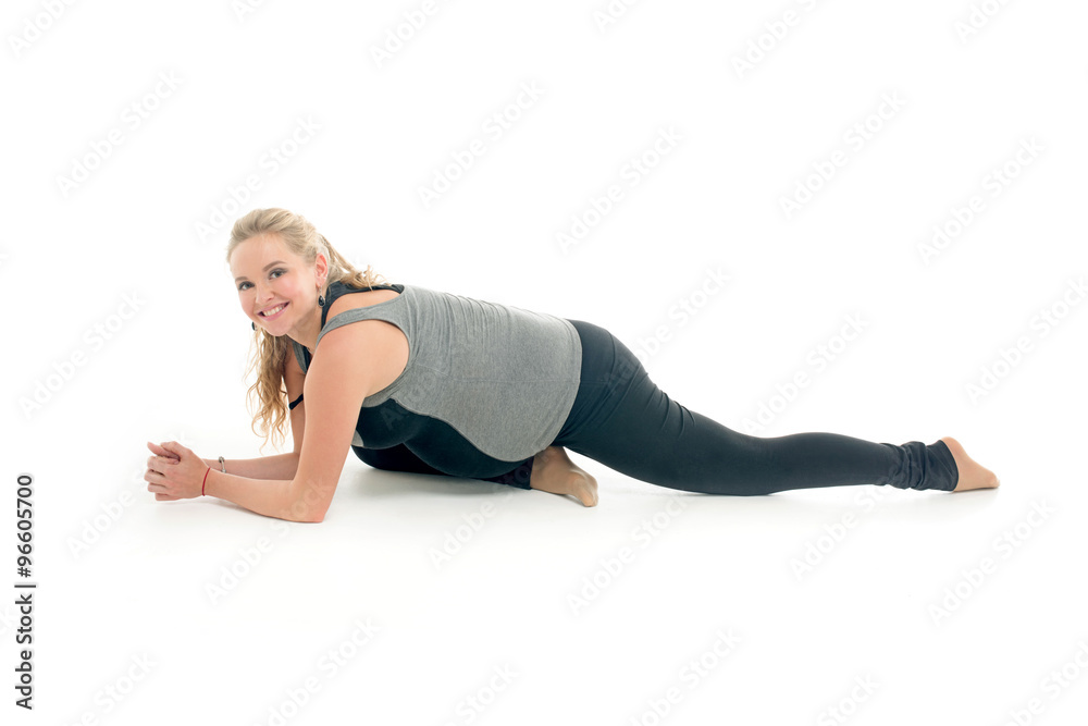 Pregnant woman doing sport exercises in yoga style Pregnant woman doing sport exercises in yoga style