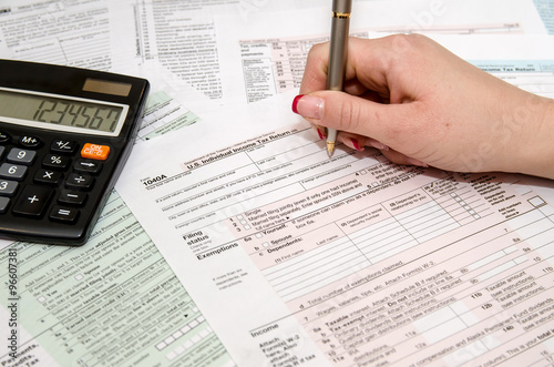 Taxpayer filling out US tax form 1040
