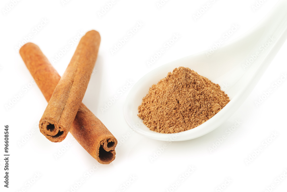 Cinnamon sticks and powder on white background