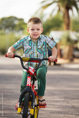 Fototapeta Naklejka Na Ścianę i Meble -  Cute Child On Bike