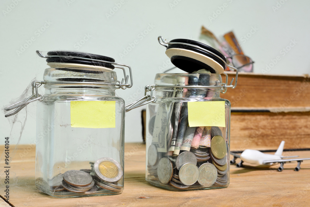 Jar for savings full of coins. Jar for savings full of coins.