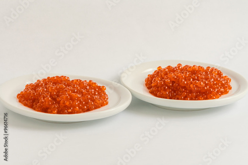 two plates of red caviar