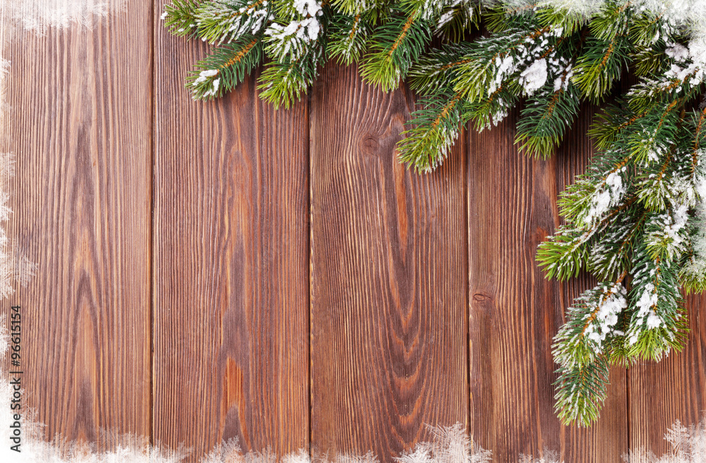 Christmas wooden background with snow fir tree Christmas wooden background with snow fir tree