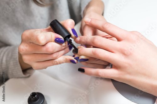 Beautiful manicure process with nail polish