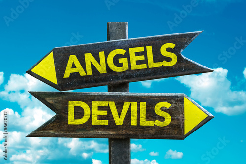 Angels - Devils signpost with sky background