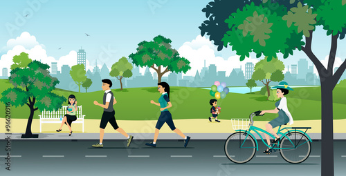 People running in the park with the city as a backdrop.