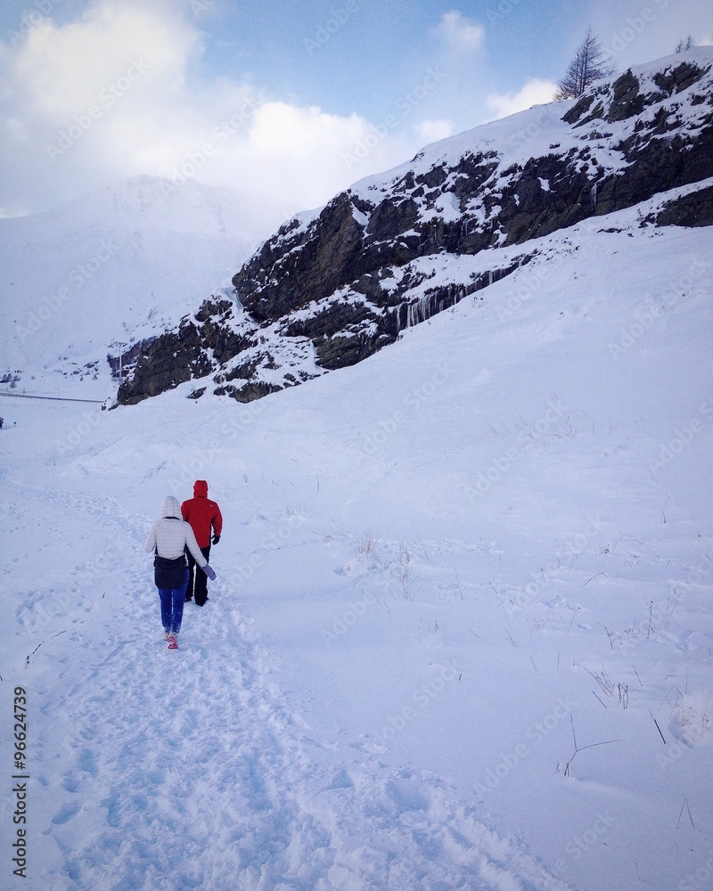 Walking among snowy alps