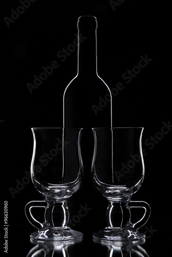 Bottle and two glasses photo