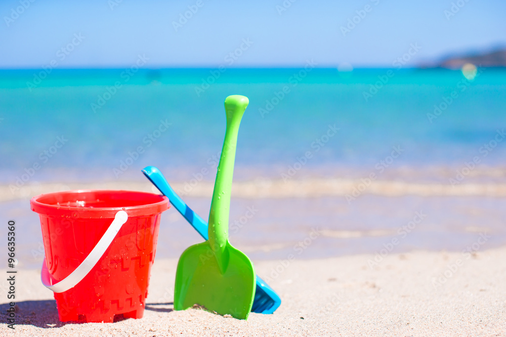 Summer kid's beach toys in the white sandy beach Summer kid's beach toys in the white sandy beach