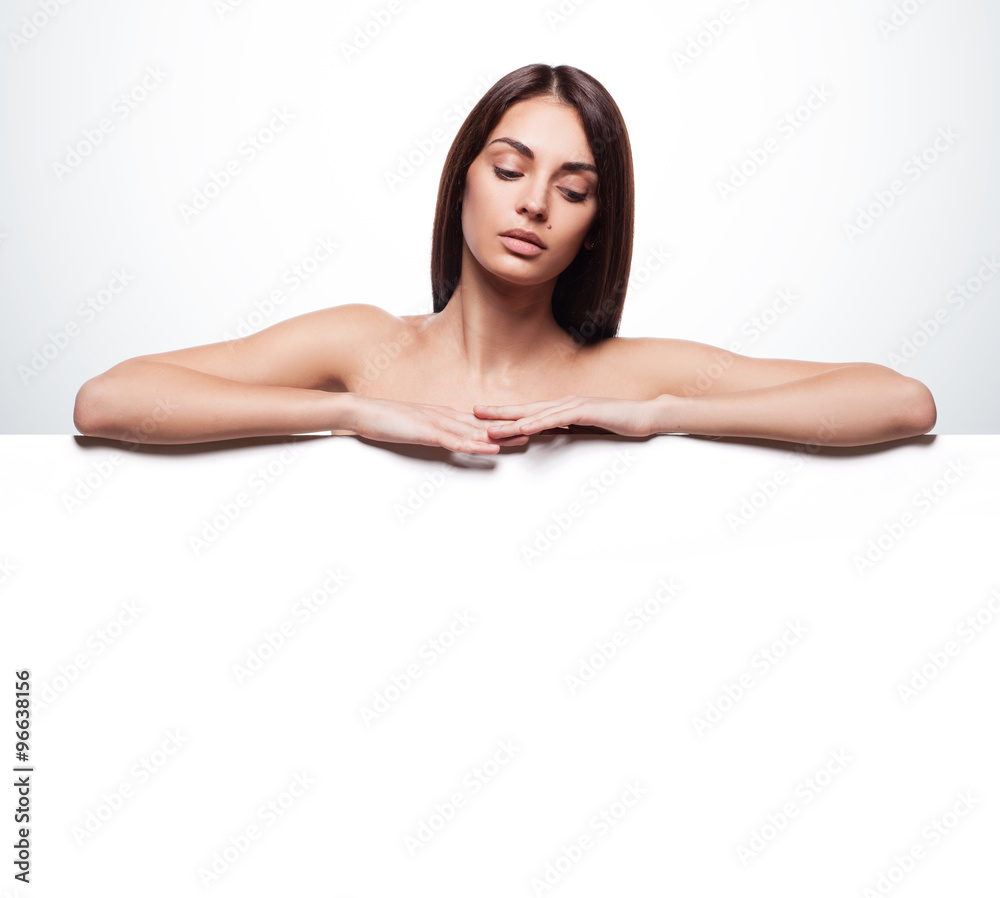 Portrait of young beautiful woman with a blank banner Portrait of young beautiful woman with a blank banner
