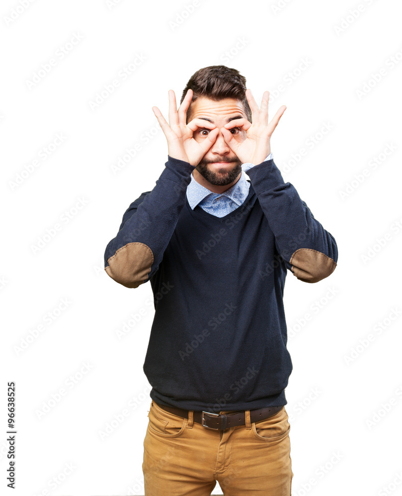 Fototapeta premium man doing a glasses sign