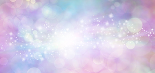 Pink and blue starry glitter feminine toned bokeh background banner - Wide pink and blue  sparkling glittery star speckled background with a whoosh of stars moving through the middle