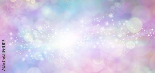 Pink and blue starry glitter feminine toned bokeh background banner - Wide pink and blue sparkling glittery star speckled background with a whoosh of stars moving through the middle