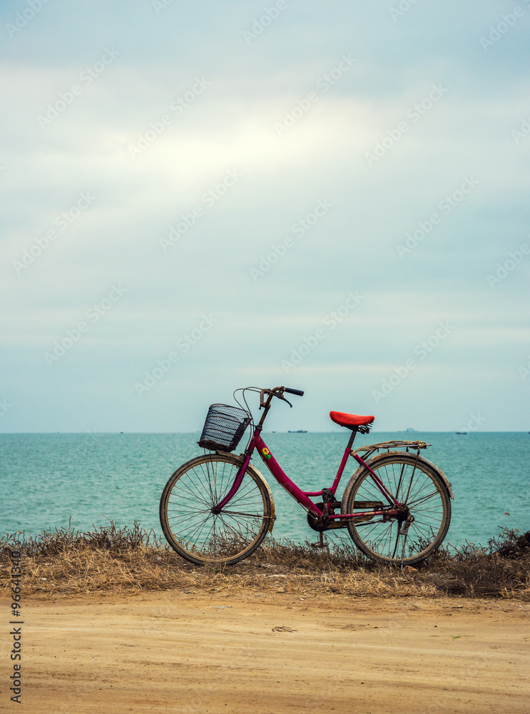 travel and relaxation concept: old bicycle at the seaside