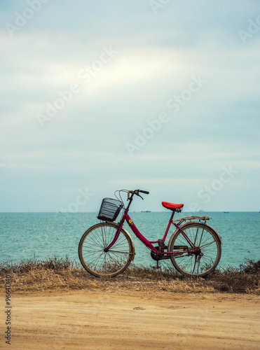 travel and relaxation concept: old bicycle at the seaside