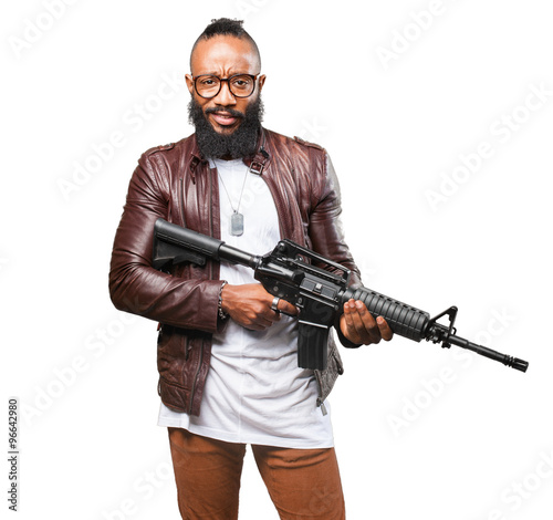 black man holding a weapon © asierromero