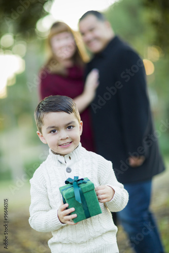 Mixed Race Boy Holding Gift...