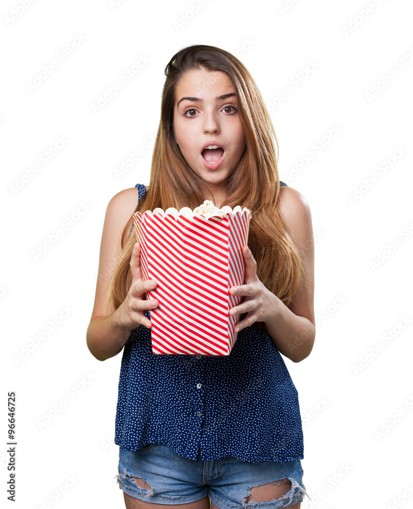 scared young woman holding popcorn scared young woman holding popcorn