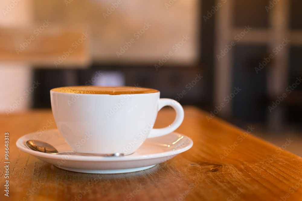 Hot art Latte Coffee in a cup on wooden table