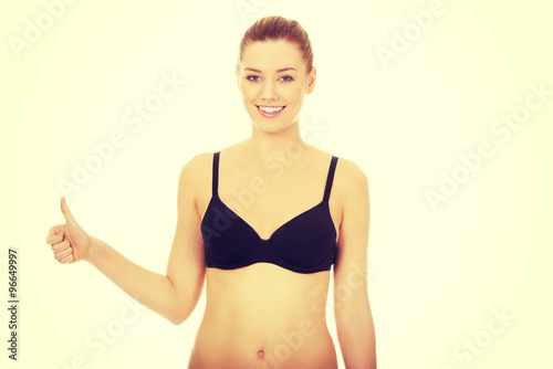 Woman in bikini with thumbs up. © Piotr Marcinski