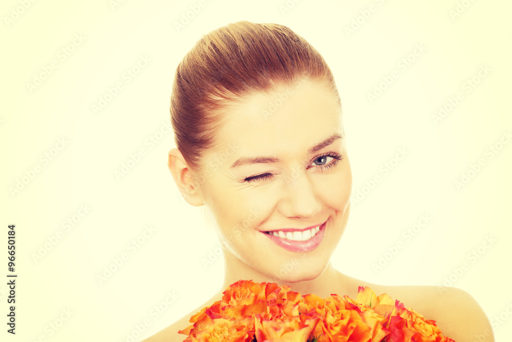 Fototapeta premium Smiling woman with fresh roses.