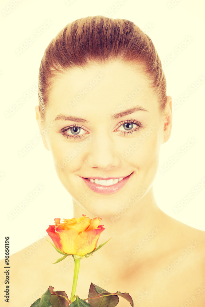 Fototapeta premium Smiling woman with fresh rose.
