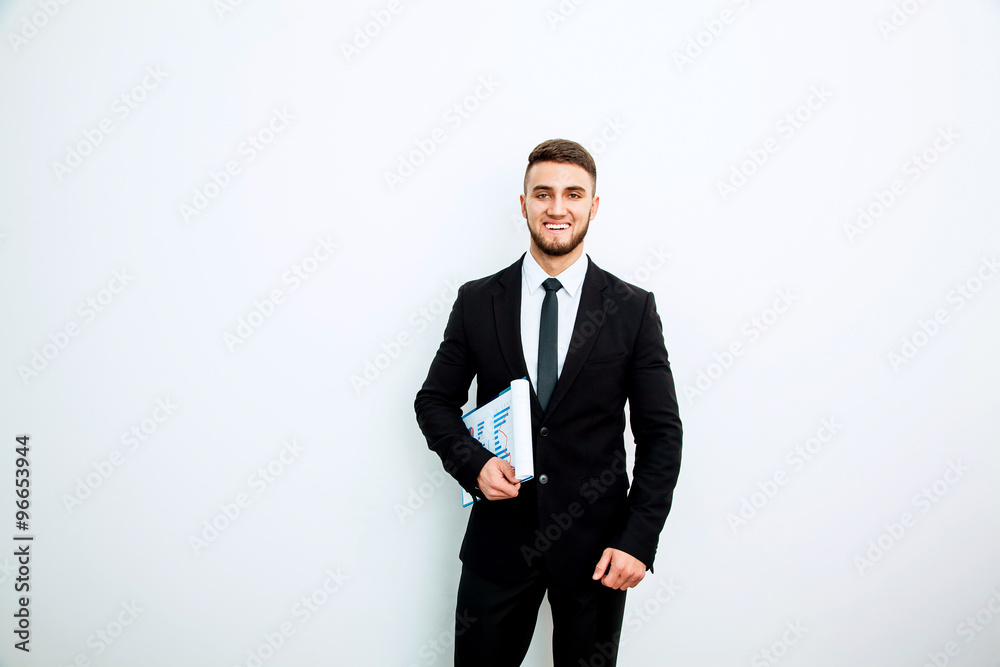 Portrait of an handsome businessman with a folder Portrait of an handsome businessman with a folder