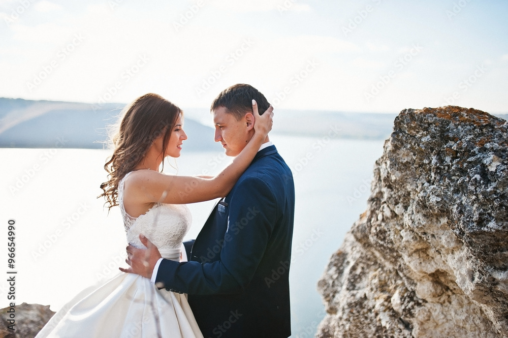 Very sensual and gorgeous wedding couple on the picturesque land