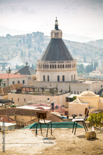 Two chairs for meditation and Basilica of Announciation in Nazar photo