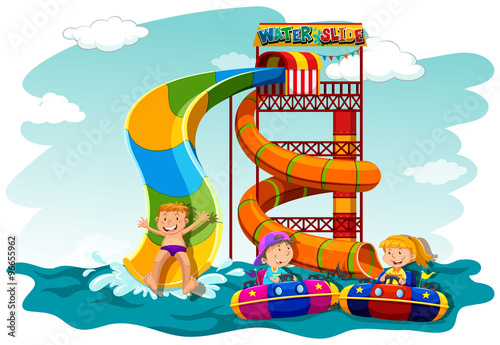 Boys and girl riding down the water slide
