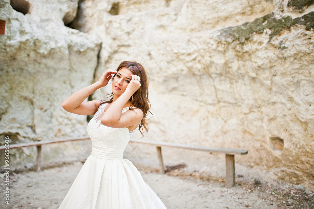 Very sensual and gorgeous bride on the picturesque landscapes