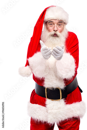 Santa claus posing with open palms over white