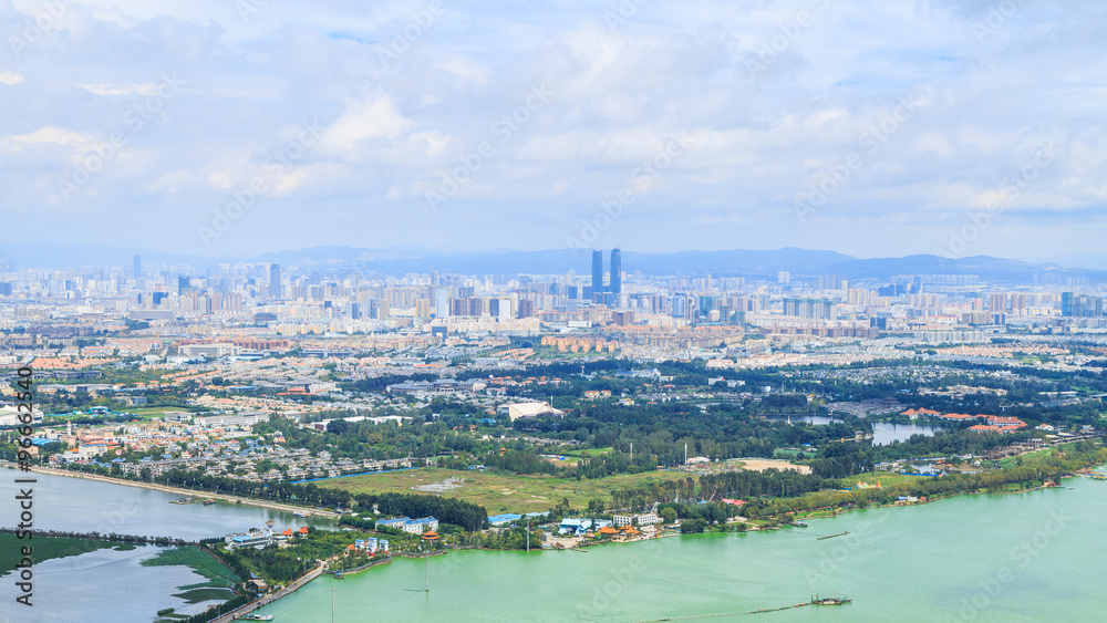 Cityscape Panorama of Kunming City from Viewpoint on Xi Chan Mountain, Yunnan, China.
