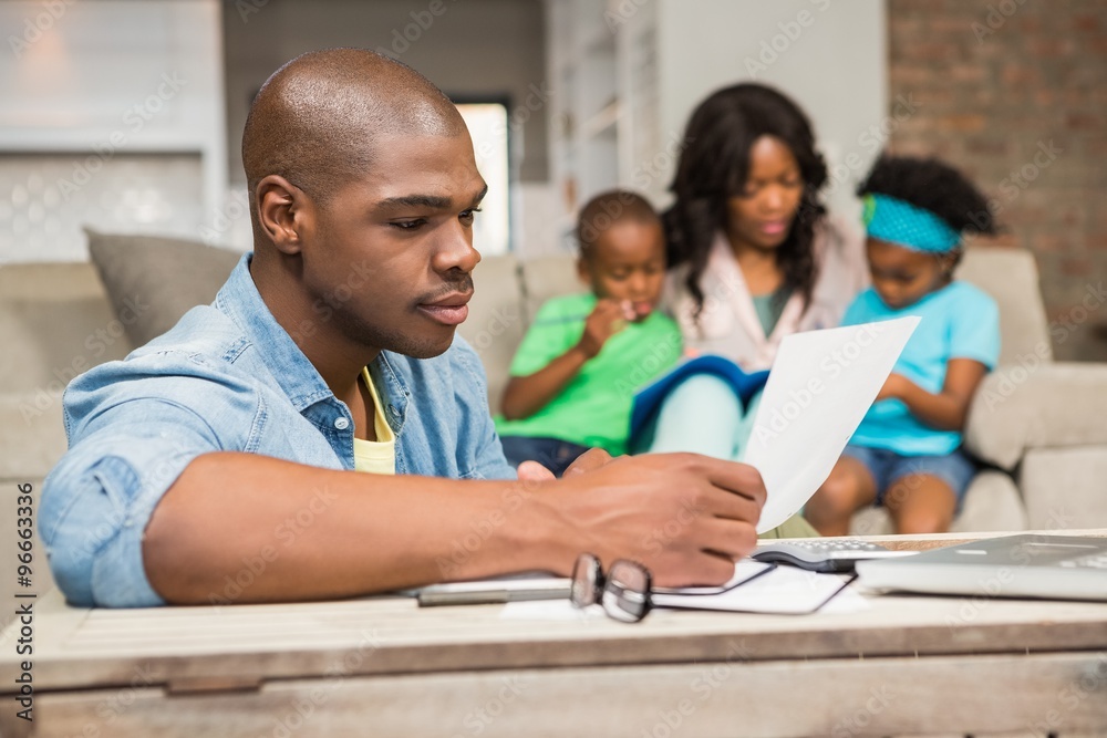 Concentrated father reading paper Concentrated father reading paper