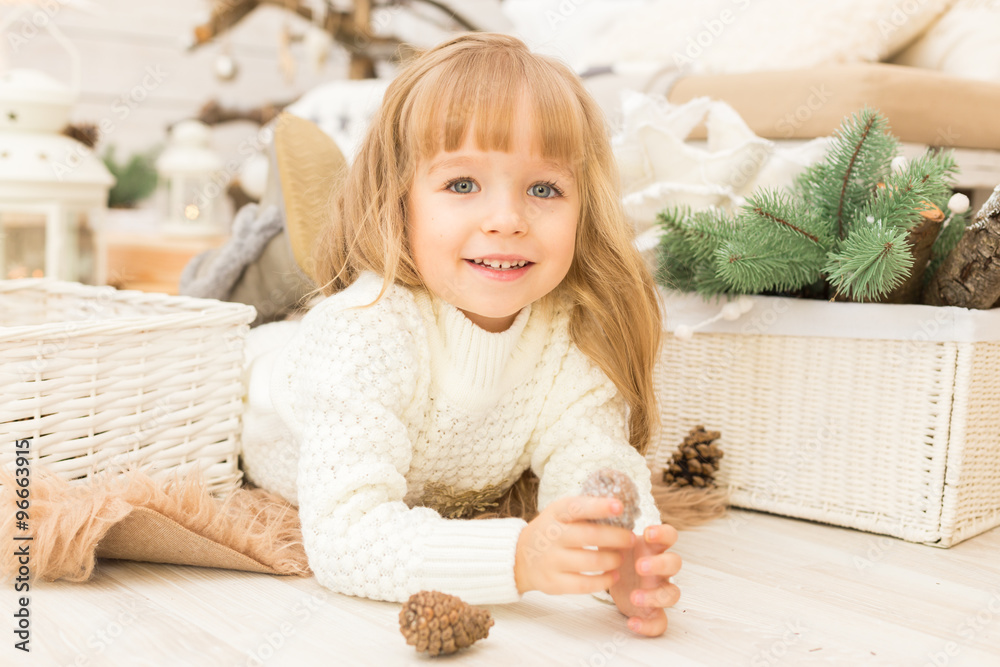 Fototapeta premium Little girl in christmas decorations